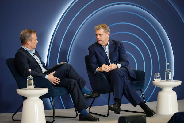 Todd Boehly (right), co-founder, chairman and CEO of Eldridge Industries, talks to Gavin Deane, Global Head of Technology, Media and Telecoms for Deutsche Bank's Investment Bank 